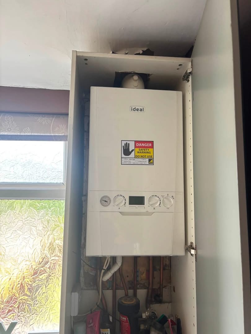 Condemned Ideal boiler with Do Not Use safety warning